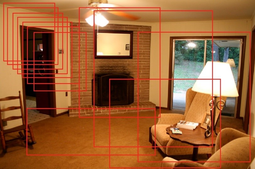 居間の画像の中で複数の赤いアウトラインが物体を囲んでいる様子