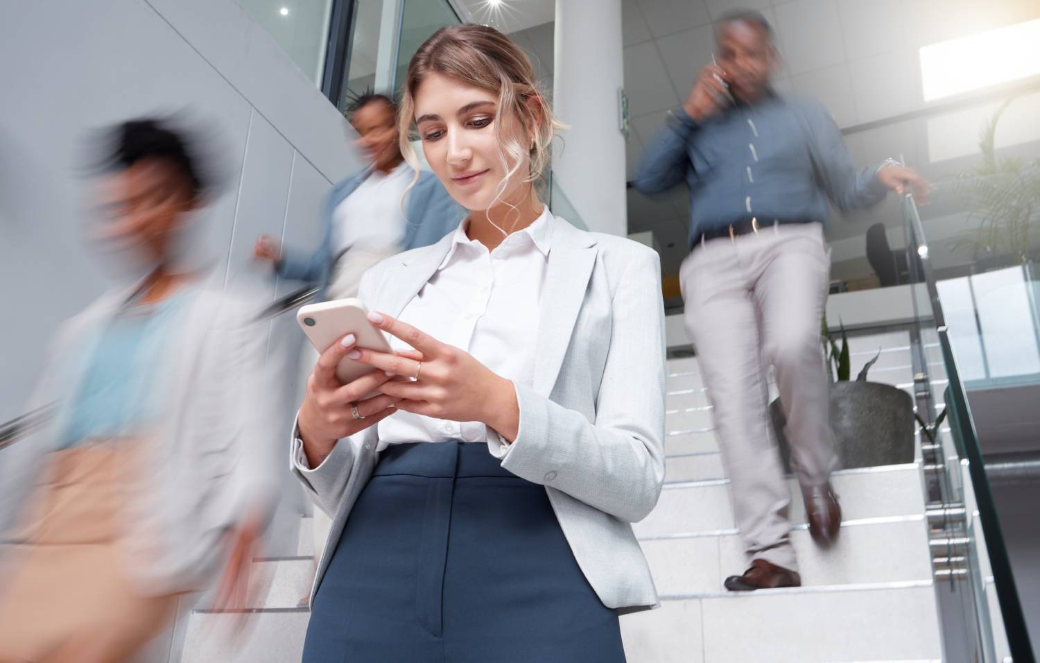 Woman distracted looking at cell phone