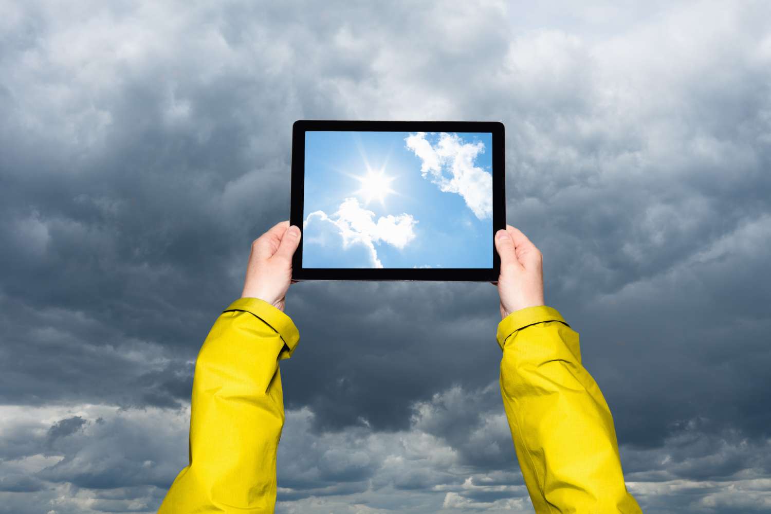 Child looking at a storm on a tablet