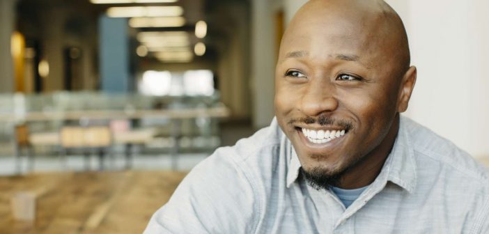 Businessman appears happy that he has been able to improve data accuracy