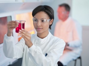 scientist in lab measuring liquid