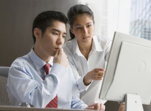 two people looking at data quality mistakes