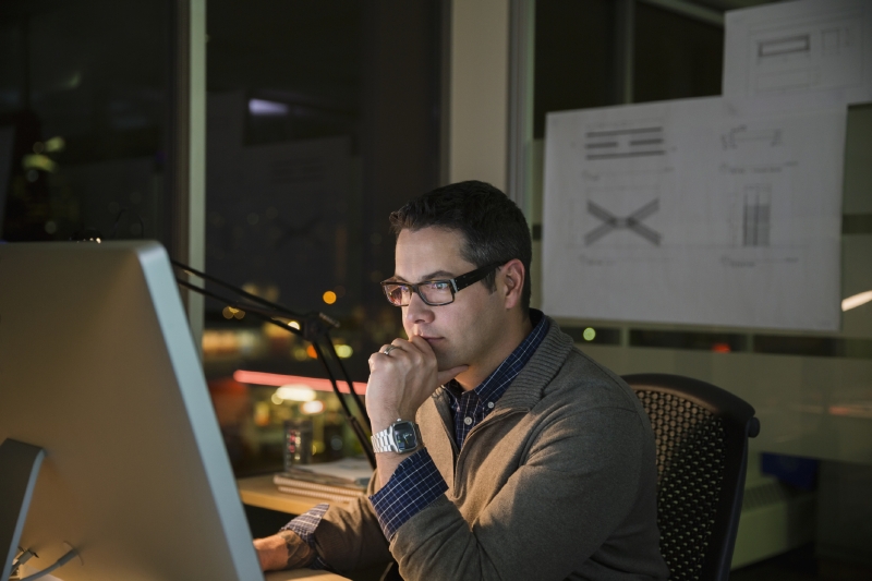 man at computer considering data ops