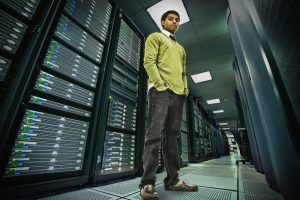 man in server room contemplating data lakes