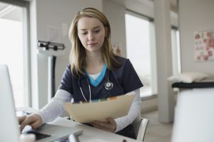 nurse holds a tarnished record