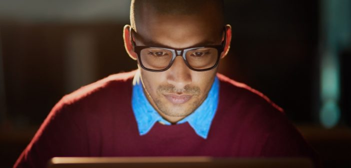 man using MDM at his computer to combat fraud