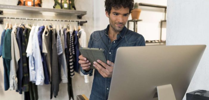 Male store owner tries to understand the data for omnichannel