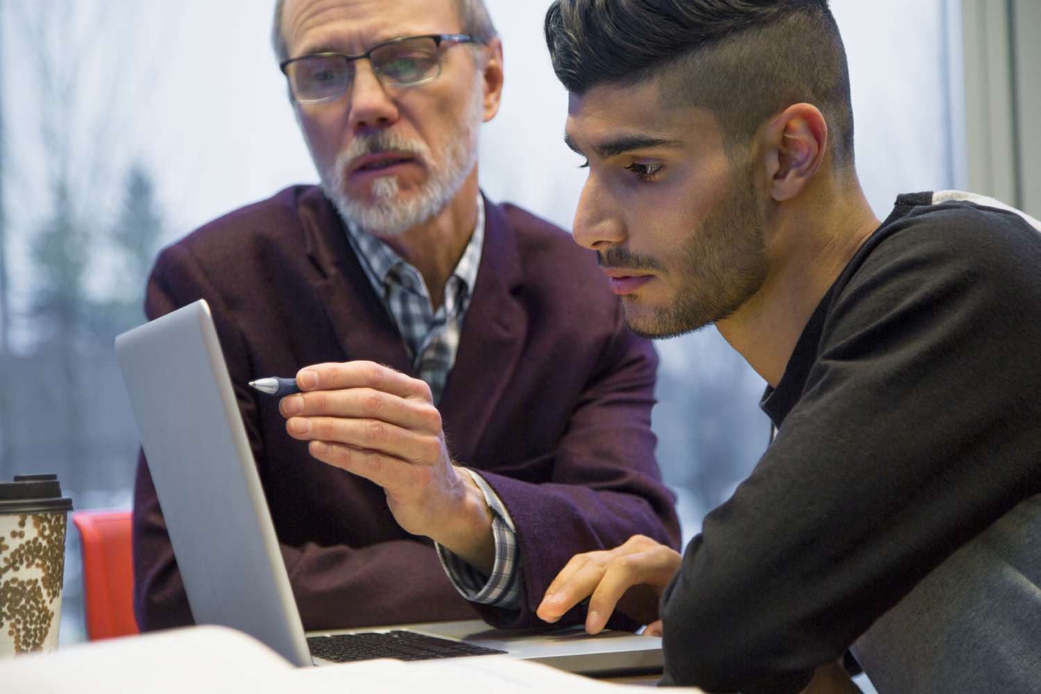 Instructor teaches student about data-driven design