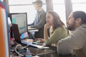 Group of data scientists studying the data