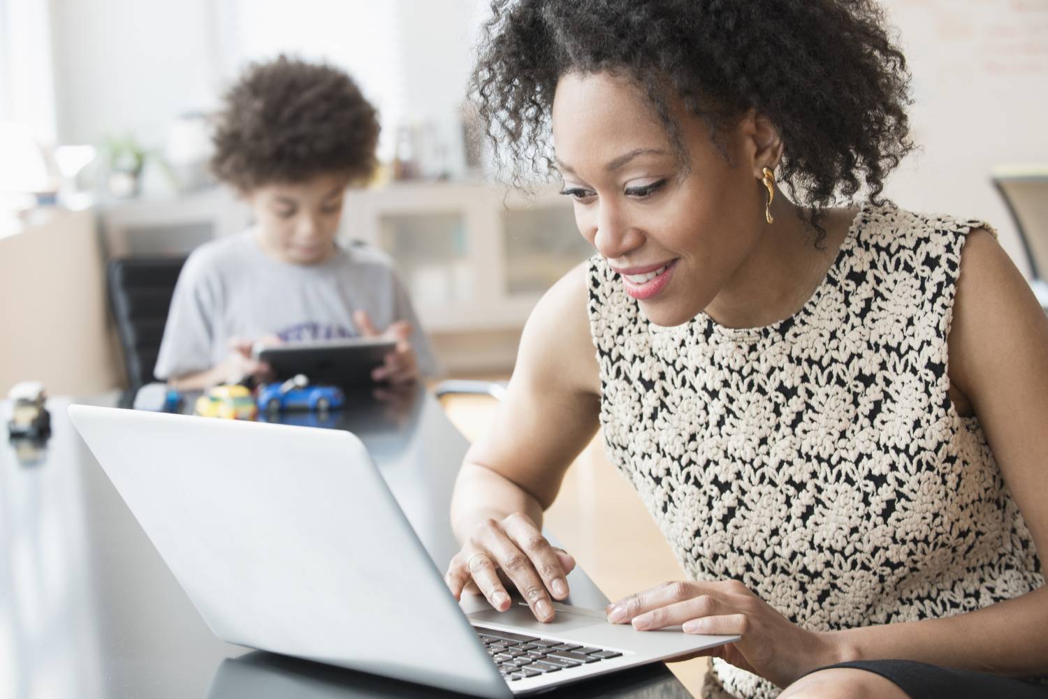 Businesswoman working from home with child on Data Privacy Day