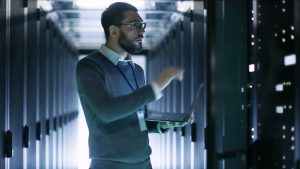 Man in server room, concept of data lake