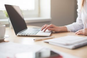 Photo of a person using a laptop