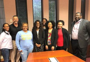 Tim Wilson and John Pierre, Chancellor of Southern University Law Center, stand with law students. 