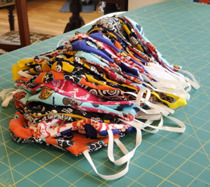 Stack of colorful, handmade masks