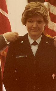 Beth receives her 2nd Lieutenant bars, pinned on by her mother and brother. 