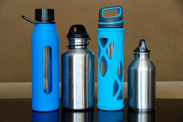 four water bottles alternating glass and stainless steel