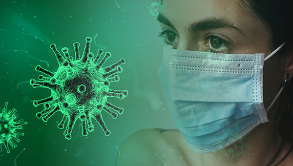 woman's face with mask and green coronavirus image