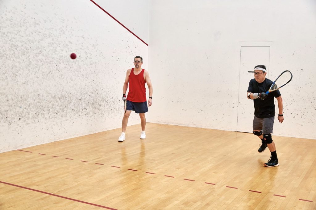 Two employees play racquetball at SAS' Recreation and Fitness Center 
