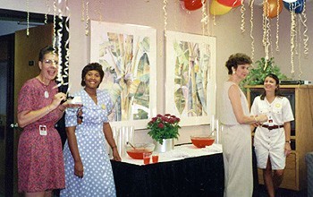 Health Care Center employees celebrate the HCC's 10th anniversary in 1994. 