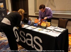 signing books at the SAS table