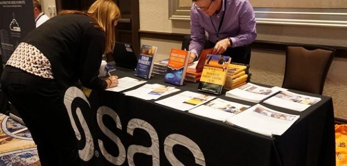 signing books at the SAS table