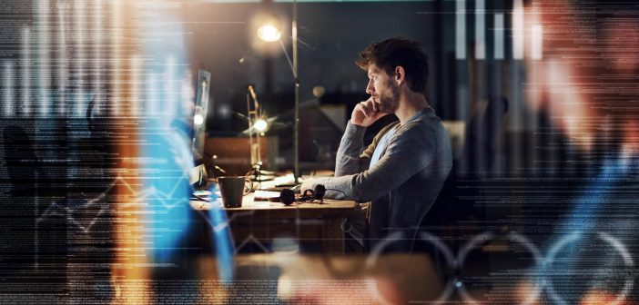 Getting codes cracked right through the night -- shot of a programmer working on a computer code at night