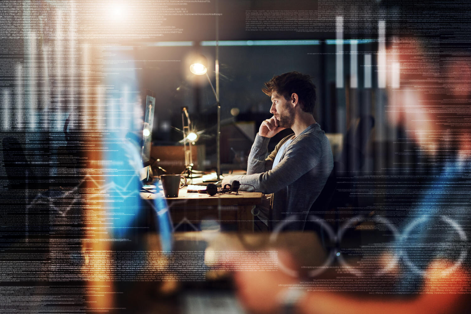 Getting codes cracked right through the night -- shot of a programmer working on a computer code at night