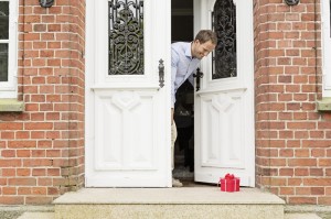 small, wrapped gift on door step