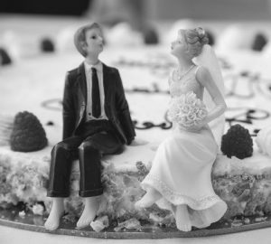 plastic bride and groom on a wedding cake