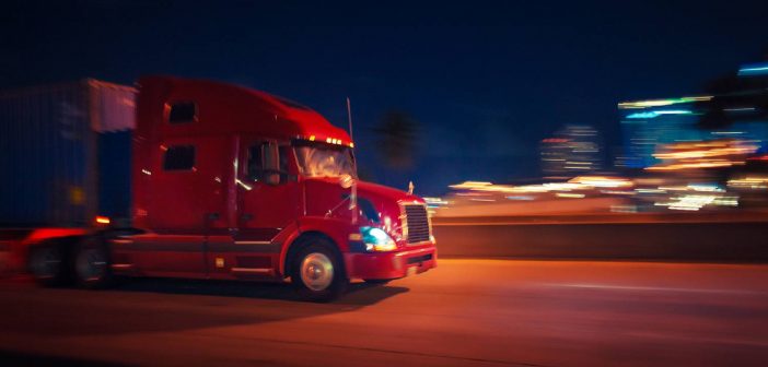 semi truck driving at night