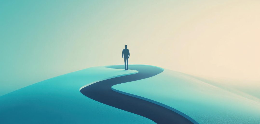 A silhouette of a business person taking a winding path. Opportunity and choice concept.