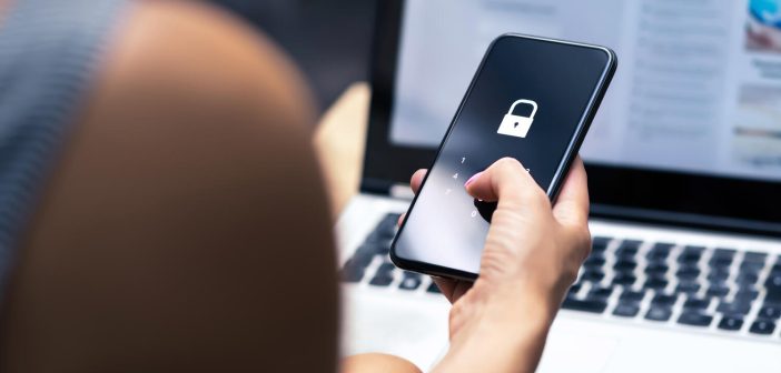 Phishing, mobile phone hacker or cyber scam concept. Password and login pass code in smartphone. Online security threat and fraud. Female scammer with cellphone and laptop. Bank account security.