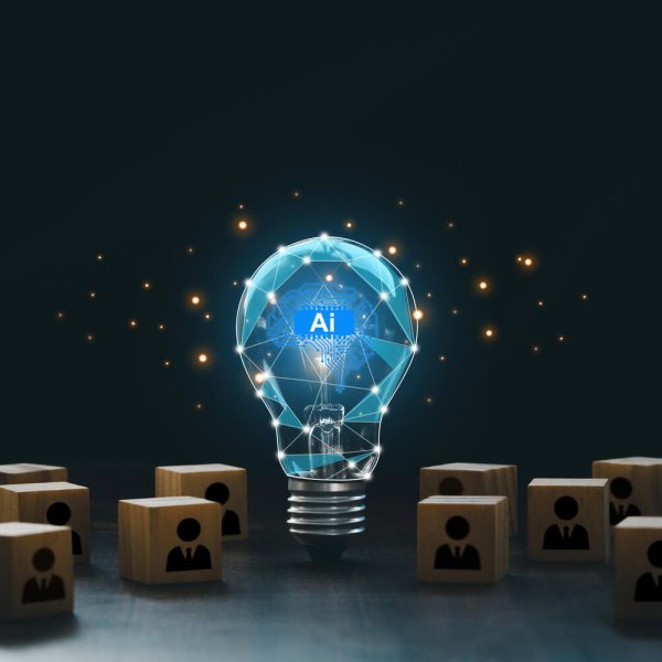 Artificial intelligence innovation. AI adoption and working. AI with a digital brain in a lightbulb with human icons in wooden blocks for AI vs human competition. manage personnel in the organization