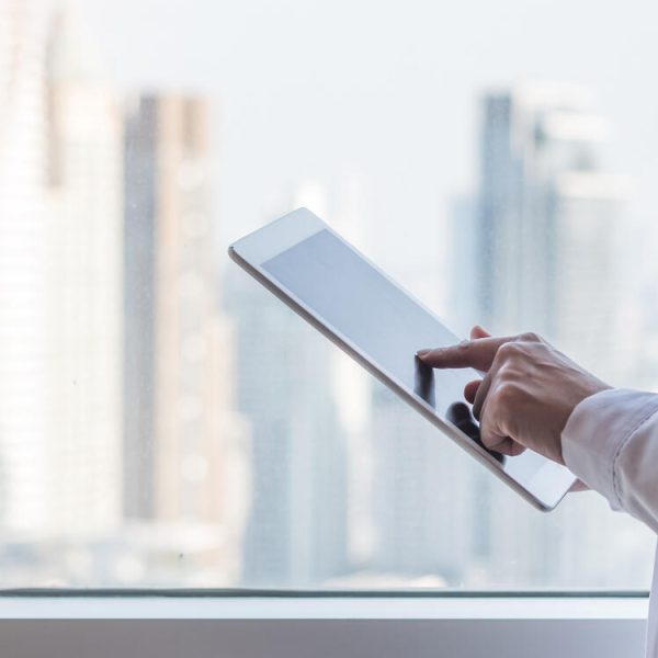 Telemedicine by medical doctor or physician consulting patient’s health telehealth online using mobile tablet in hospital for professional digital emergency tele-healthcare assistance service